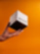 Omni Candle Box Shown In An Orange Background